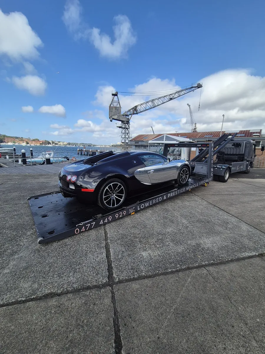 Bugatti Veyron delivered, Sydney Harbour behind